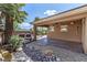 Outdoor covered patio perfect for entertaining and relaxing, with desert rock landscape at 11177 Twilight Times Ct, Las Vegas, NV 89135