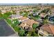 Aerial shot showcasing the neighborhood with lush trees and manicured lawns at 11340 Espadrille Ct, Las Vegas, NV 89138