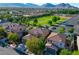 Residential neighborhood with mountain views, green spaces, and modern homes at 11340 Espadrille Ct, Las Vegas, NV 89138