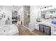 Nicely-appointed bathroom with double sinks, vanity area, soaking tub, and glass walk-in shower at 11340 Espadrille Ct, Las Vegas, NV 89138