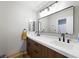 Modern bathroom with double vanity, quartz countertops, sleek faucets and framed mirrors at 11340 Espadrille Ct, Las Vegas, NV 89138