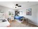 Bedroom with a ceiling fan, neutral paint and carpet with a bed and built-in storage at 11340 Espadrille Ct, Las Vegas, NV 89138