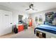 Bedroom features neutral paint, carpet, a ceiling fan, desk and a built in bed with storage at 11340 Espadrille Ct, Las Vegas, NV 89138
