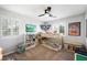 Cozy bedroom featuring a bunk bed, ceiling fan, and natural light from shuttered windows at 11340 Espadrille Ct, Las Vegas, NV 89138
