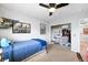 Bedroom features neutral paint, carpet, ceiling fan and a closet with shelving at 11340 Espadrille Ct, Las Vegas, NV 89138
