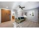 Upstairs bonus room offers a ceiling fan, neutral paint, carpet and an attached bath at 11340 Espadrille Ct, Las Vegas, NV 89138