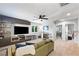Upstairs bonus room with neutral carpet, ceiling fan, modern built-ins and lots of natural light at 11340 Espadrille Ct, Las Vegas, NV 89138
