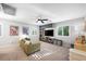 Spacious bonus room with neutral carpet, ceiling fan, and a large built-in entertainment center at 11340 Espadrille Ct, Las Vegas, NV 89138