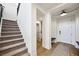Welcoming entryway featuring a staircase, neutral decor, and easy access to the main living areas at 11340 Espadrille Ct, Las Vegas, NV 89138