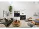 Bright and airy living space with high ceilings, modern fireplace, and comfortable seating arrangement at 11340 Espadrille Ct, Las Vegas, NV 89138
