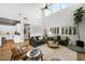 Bright and airy living room featuring high ceilings, and an open floor plan leading to the kitchen at 11340 Espadrille Ct, Las Vegas, NV 89138