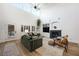 Bright and airy living space with high ceilings, modern fireplace, and comfortable seating arrangement at 11340 Espadrille Ct, Las Vegas, NV 89138