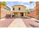 Well maintained backyard featuring pavers, a covered patio, and privacy wall at 11755 Garland Grove Ln, Las Vegas, NV 89183