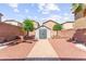 A shed sits at the back of the yard with trees and a stone walkway at 11755 Garland Grove Ln, Las Vegas, NV 89183