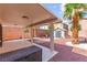 The backyard features a shed, gravel ground, palm trees, and a covered patio at 11755 Garland Grove Ln, Las Vegas, NV 89183