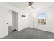 Bedroom featuring carpet floors, a ceiling fan and a closet with mirrored sliding doors at 11755 Garland Grove Ln, Las Vegas, NV 89183