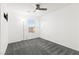 Well-lit bedroom offering carpet floors, a ceiling fan and a view from the window at 11755 Garland Grove Ln, Las Vegas, NV 89183