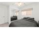Bedroom with mirrored closet doors, neutral paint and a ceiling fan at 11755 Garland Grove Ln, Las Vegas, NV 89183