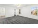 Bedroom featuring carpet, a ceiling fan, and natural light, leading to walk-in closet at 11755 Garland Grove Ln, Las Vegas, NV 89183