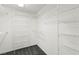 Walk-in closet featuring plenty of storage space with multiple wire shelving units at 11755 Garland Grove Ln, Las Vegas, NV 89183