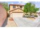 Charming two-story home with a two car garage, mature landscaping and shade trees at 11755 Garland Grove Ln, Las Vegas, NV 89183