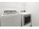 Laundry room with white washer and dryer appliances at 11755 Garland Grove Ln, Las Vegas, NV 89183