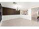 Spacious living room featuring modern tile floors and stylish accent wall for a contemporary feel at 11755 Garland Grove Ln, Las Vegas, NV 89183