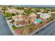 Aerial view of a landscaped yard with a pool and jacuzzi, perfect for relaxing and entertaining at 1200 Dream Bridge Dr, Las Vegas, NV 89144