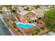 Aerial view showcases the outdoor living area including pool, dining area and covered patio at 1200 Dream Bridge Dr, Las Vegas, NV 89144
