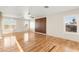 Spacious bedroom with wood floors, ceiling fan, natural light, and modern design elements at 1200 Dream Bridge Dr, Las Vegas, NV 89144