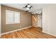 Bedroom with hardwood floors, bright windows and a sliding barn door to the closet at 1200 Dream Bridge Dr, Las Vegas, NV 89144