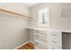 Walk-in closet featuring custom shelving and drawers for optimal organization at 1200 Dream Bridge Dr, Las Vegas, NV 89144