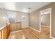 Upstairs hallway featuring hardwood floors and views of multiple windows at 1200 Dream Bridge Dr, Las Vegas, NV 89144