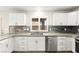 Bright kitchen featuring stainless steel appliances and white cabinets at 1200 Dream Bridge Dr, Las Vegas, NV 89144