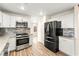 A bright kitchen features stainless appliances and white cabinets at 1200 Dream Bridge Dr, Las Vegas, NV 89144