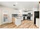 Modern kitchen with white cabinets, stainless steel appliances, and stylish backsplash, offering both functionality and style at 1200 Dream Bridge Dr, Las Vegas, NV 89144