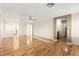 Large living room featuring wood floors, natural light, and doorways to other rooms at 1200 Dream Bridge Dr, Las Vegas, NV 89144