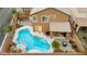 Backyard pool with jacuzzi, and desert landscaping, creating a relaxing outdoor space at 1200 Dream Bridge Dr, Las Vegas, NV 89144