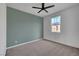 Bedroom with carpet, ceiling fan, and a bright window at 1200 Paradise Basin Ct, Henderson, NV 89002