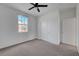 Bedroom with carpet, ceiling fan, window, and closet at 1200 Paradise Basin Ct, Henderson, NV 89002