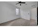Bright, carpeted bedroom featuring a ceiling fan, window and closet at 1200 Paradise Basin Ct, Henderson, NV 89002