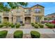 Charming townhome with a manicured front yard, sidewalk, and inviting entrance showcasing the lovely curb appeal at 1200 Paradise Basin Ct, Henderson, NV 89002