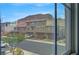 View of well maintained townhomes, each with attached garages and desert landscaping at 1200 Paradise Basin Ct, Henderson, NV 89002