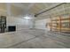 Spacious garage with overhead lighting and storage shelving at 1200 Paradise Basin Ct, Henderson, NV 89002