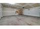Spacious garage with overhead lighting and storage shelving at 1200 Paradise Basin Ct, Henderson, NV 89002