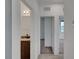 Hallway featuring a bathroom, access to other rooms, and tile flooring at 1200 Paradise Basin Ct, Henderson, NV 89002