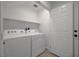 Bright laundry room with white washer and dryer at 1200 Paradise Basin Ct, Henderson, NV 89002