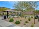 Community area featuring shaded picnic tables, a playground, and lush greenery at 1200 Paradise Basin Ct, Henderson, NV 89002