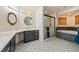 Luxurious bathroom featuring dual vanities, a soaking tub, and a walk-in shower at 1251 Cavalry St, Pahrump, NV 89048