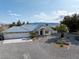 Exterior view of the home, featuring a wide driveway and well-maintained landscaping at 1251 Cavalry St, Pahrump, NV 89048